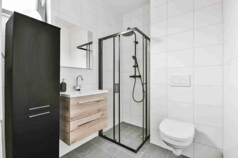a bathroom with a shower and sink